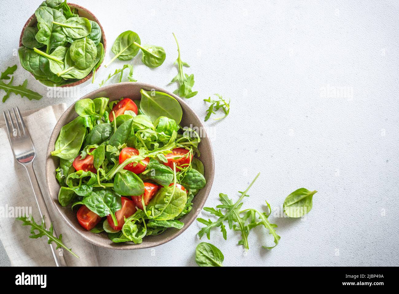 Green salad with fresh leaves and tomatoes Stock Photo Alamy