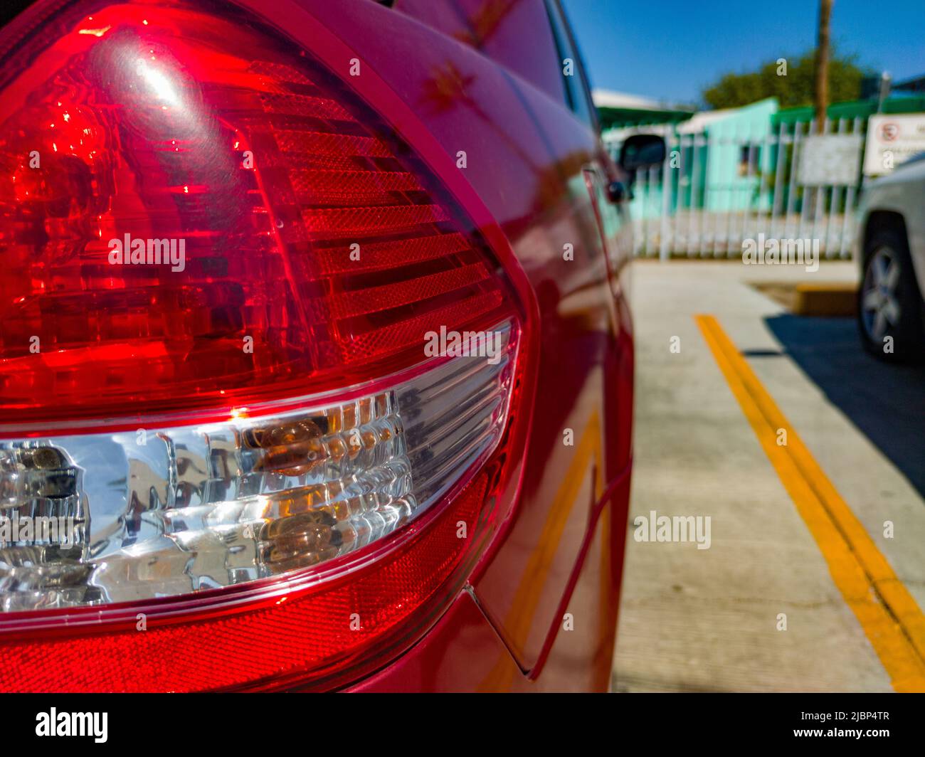 Perspective view of a rear light of a parked car Stock Photo