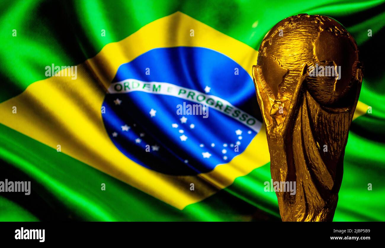 October 6, 2021 Brasilia, Brazil. FIFA World Cup on the background of the flag of Brazil. Stock Photo
