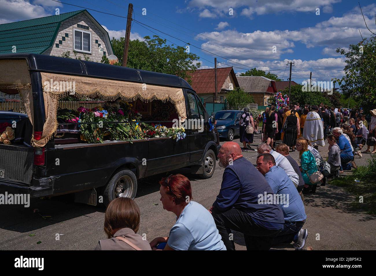 Ivankiv, Ukraine. 06th June, 2022. Ivankiv residents pay respect during ...