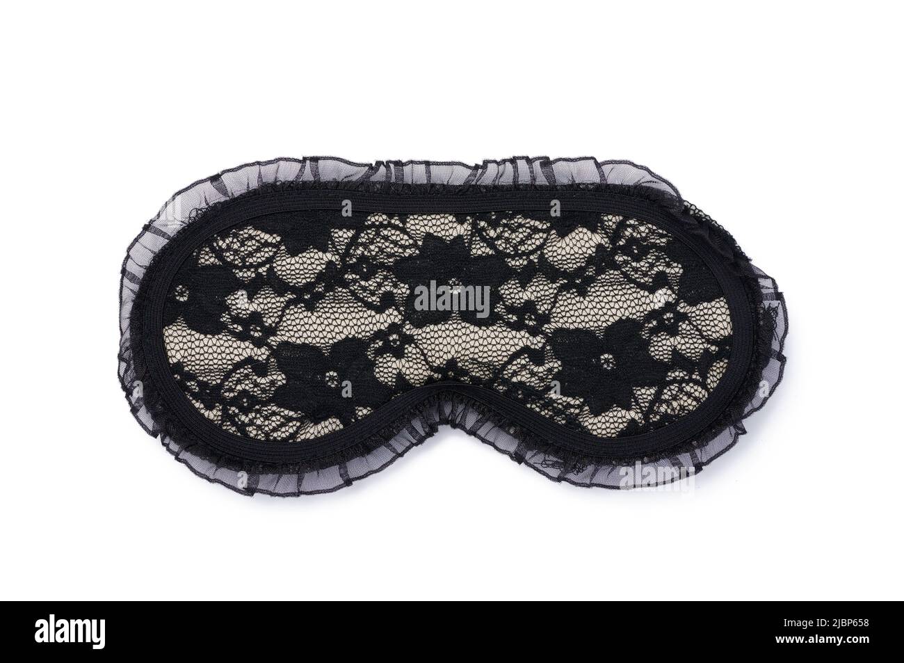 Lace black textile sleep mask on a white isolated background, top view