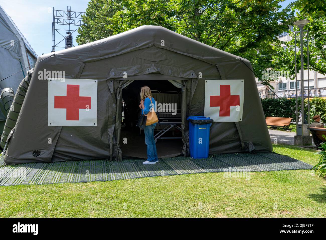 Red cross army tent in urban zones. Army help for wounded and refugees. Urban War zones. Humanitarian help on war zones. Stock Photo