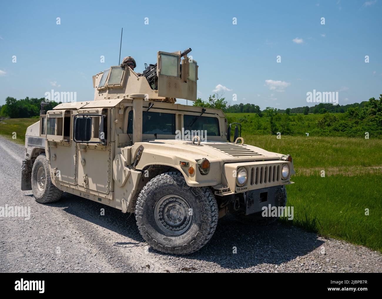 A U.S. Reserve Marine assigned to the Combined Anti-Armor Team, Weapons Company, 3rd Battalion, 23rd Marine Regiment, 4th Marine Division, secures a position with a MK19 40mm grenade machine gun mounted on a Humvee during a mission rehearsal exercise at Fort Campbell, Kentucky, May 19, 2022. Weapons Company convened with other units from 3/23 at Fort Campbell for a mission rehearsal exercise to prepare for the upcoming Integrated Training Exercise 4-22 in the summer of 2022. The Combined Anti-Armor Team Marines conducted machine gun ranges and convoy operations with quick reaction drills. (U.S Stock Photo