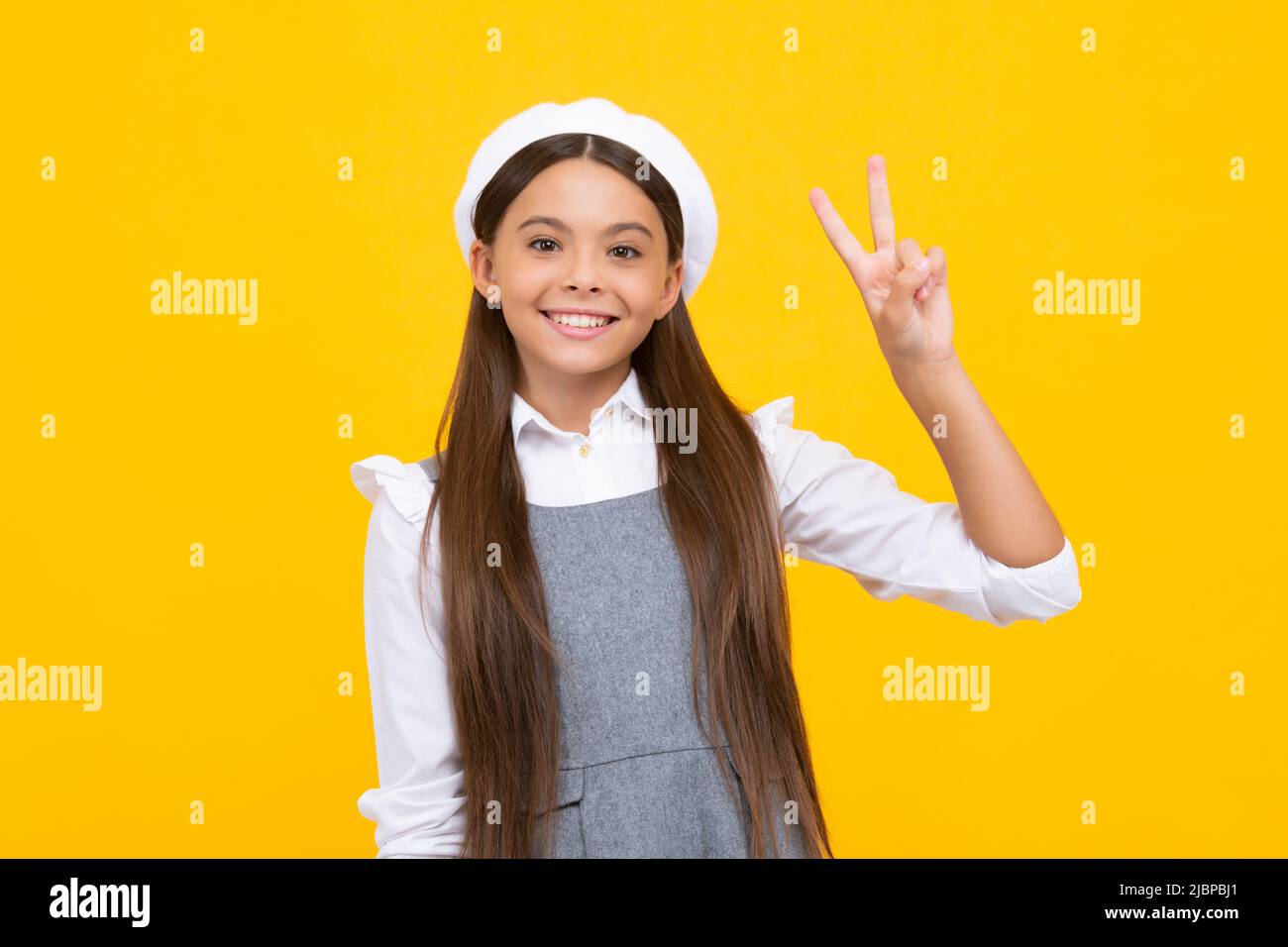 Premium Photo  Cute little indian girl wearing health mask, facing camera,  isolated over orange background