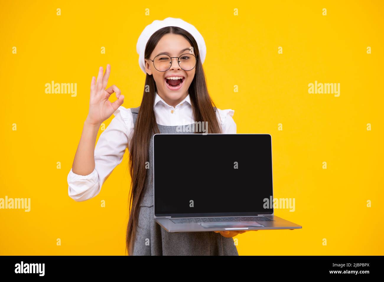 Student teenager schoolgirl with laptop on isolated background. Online ...