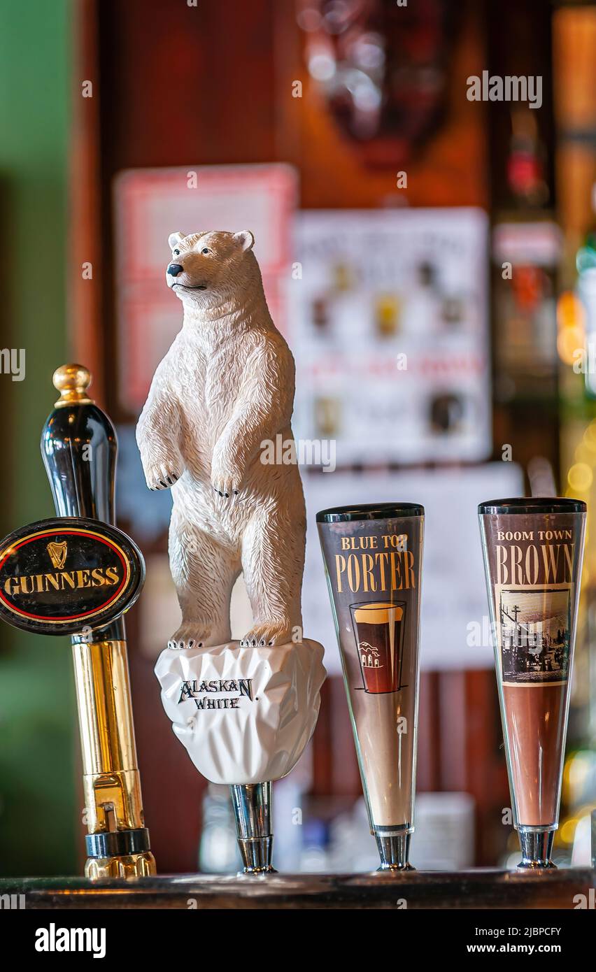 Skagway, Alaska, USA July 20, 2011 Closeup of 4 taphandles at Skagway Brewing Company bar on