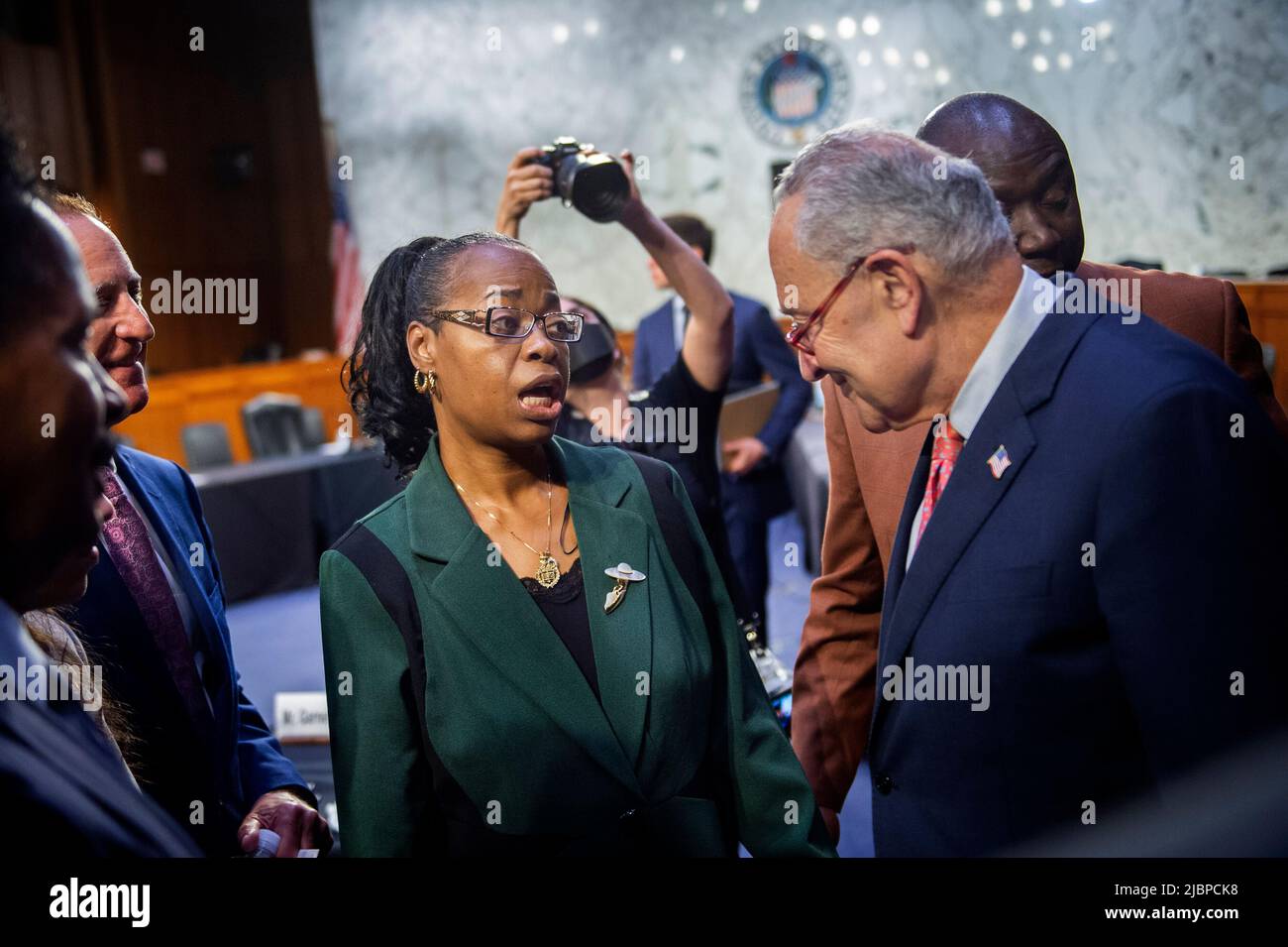 Kimberly Salter, left, wife of Tops Security Guard Aaron Salter, Jr., who died in the Buffalo, New York, Tops supermarket mass shooting implores for United States Senate Majority Leader Chuck Schumer (Democrat of New York), right, to âdo somethingâ, following a Senate Committee on the Judiciary hearing to examine domestic terrorism threat after the Buffalo attack, in the Hart Senate Office Building in Washington, DC, Tuesday, June 7, 2022. Credit: Rod Lamkey/CNP Stock Photo