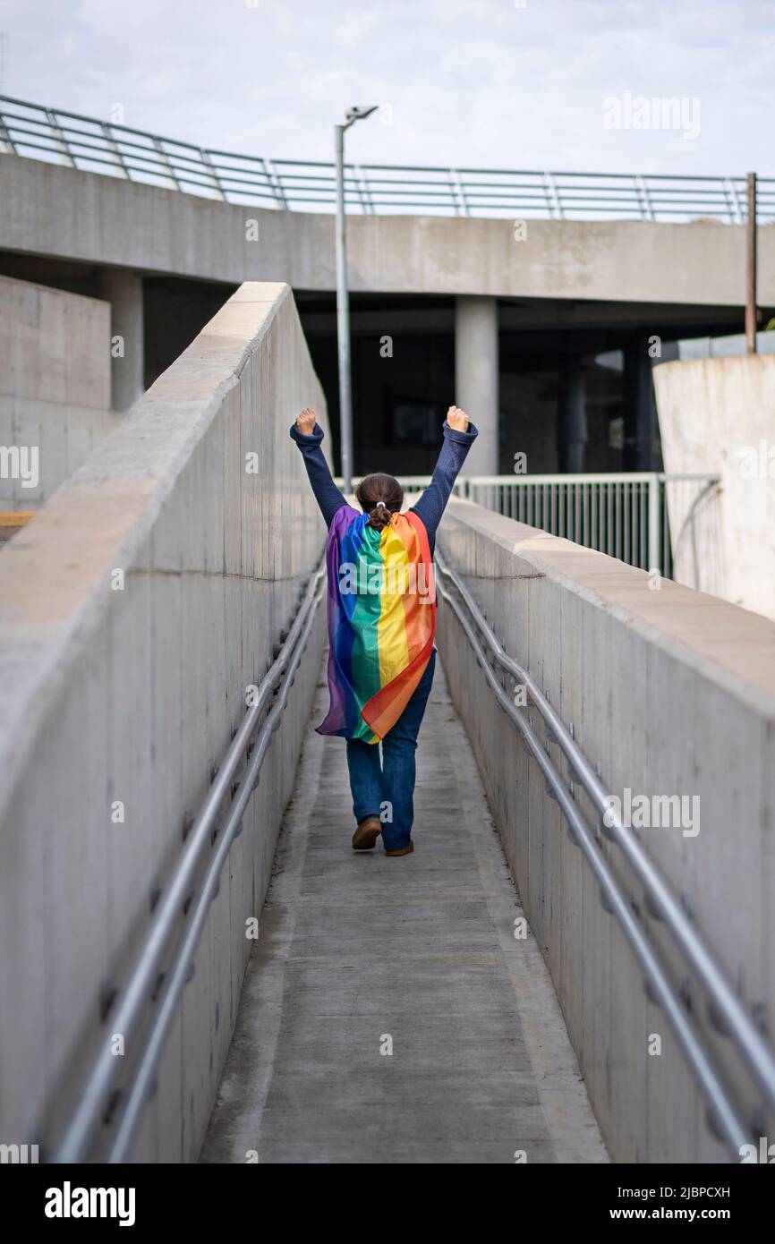 Woman from the back holding lgbt flag Stock Photo