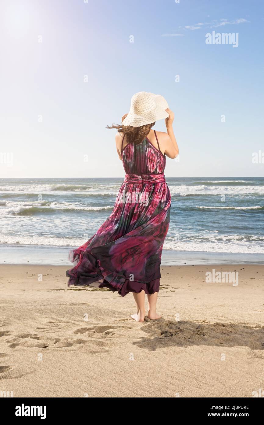 Summer Lifestyle Portrait of a Young Women at the Beach Stock Photo