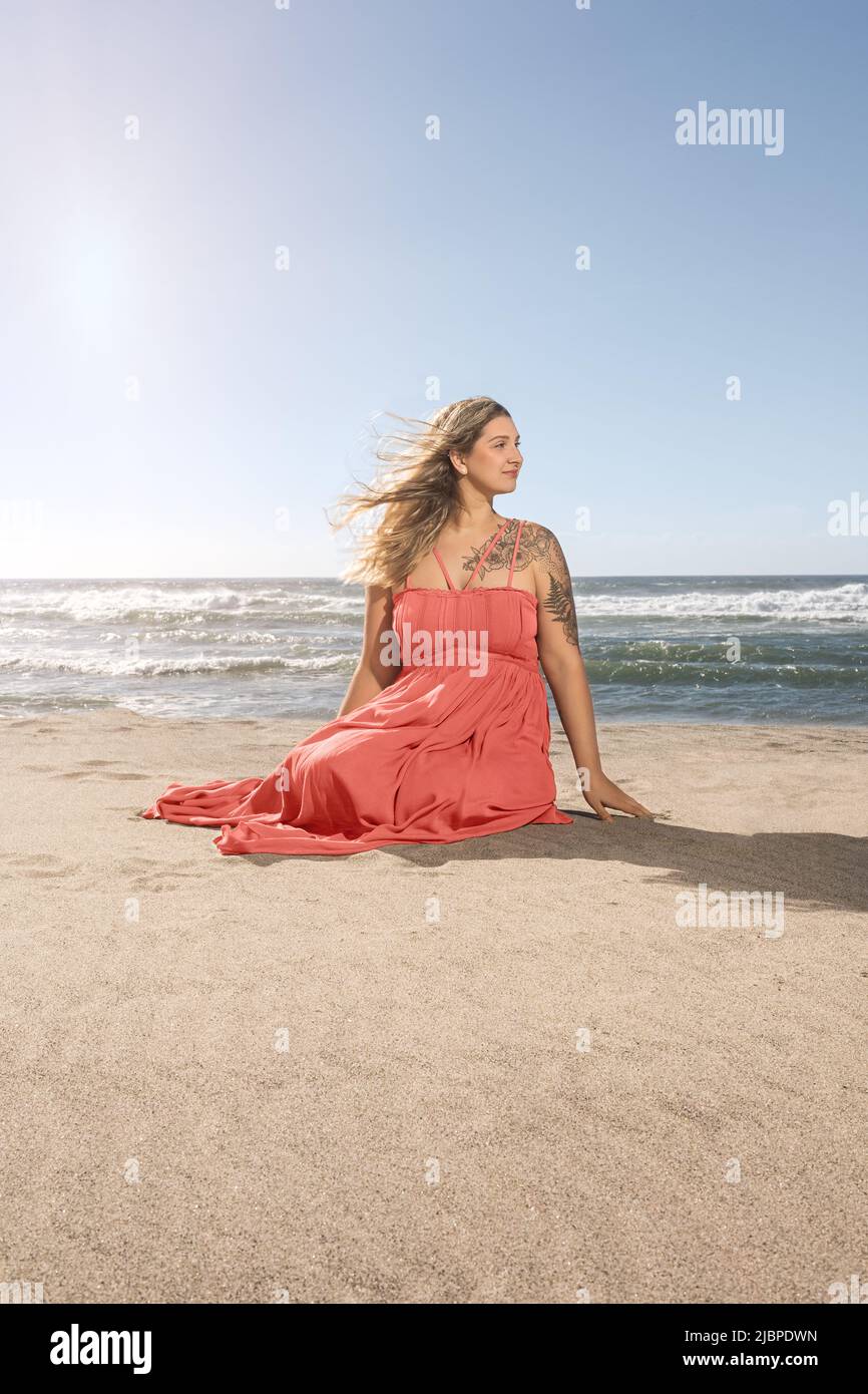 Summer Lifestyle Portrait of a Young Women at the Beach Stock Photo