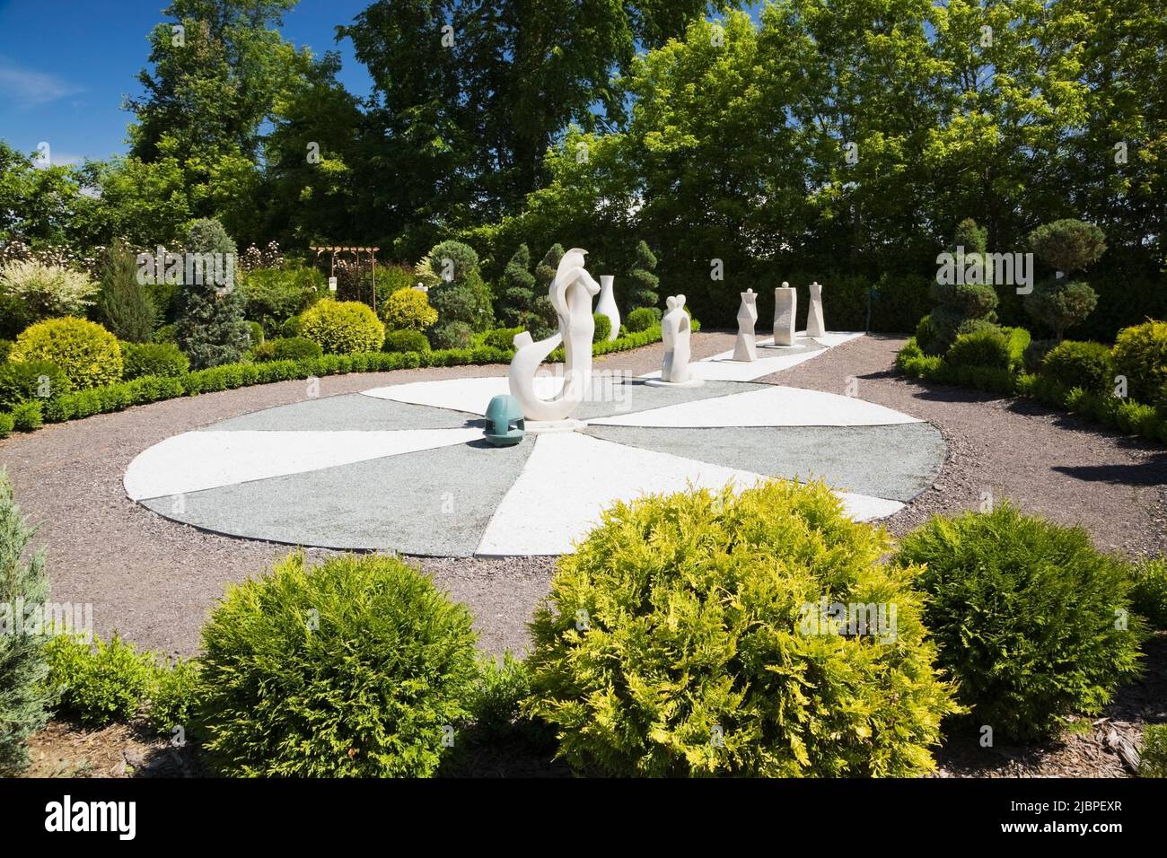 Sculptures in the French formal garden at the Route des Gerbes d'Angelica garden in spring, Mirabel, Quebec, Laurentians, Canada. Stock Photo