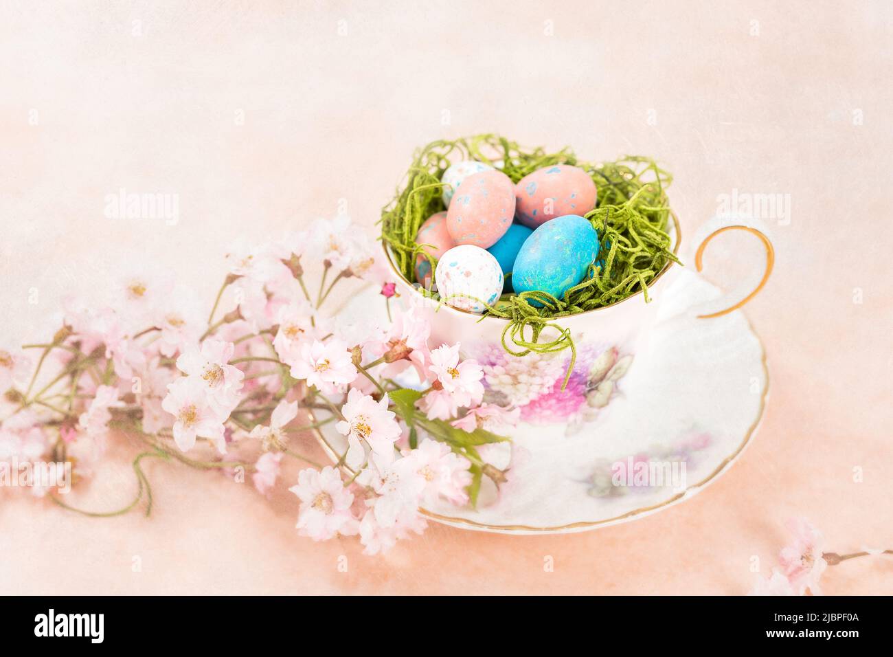 Pastel Easter Candy Displayed in a Vintage Cup and Saucer Stock Photo