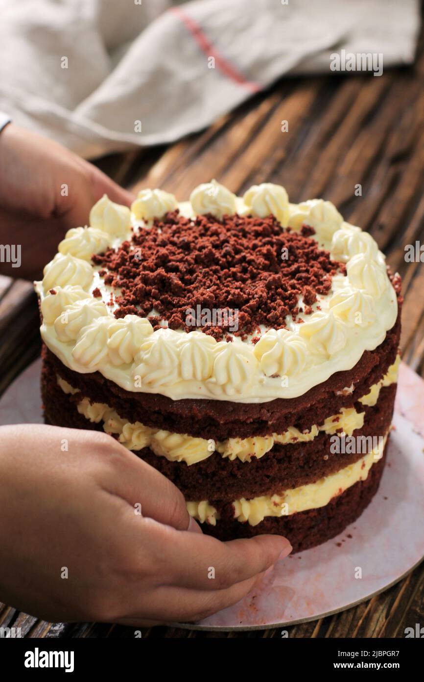 Whole Red Velvet Cake with Cream Cheese Frosting and Crumb, on Rustic