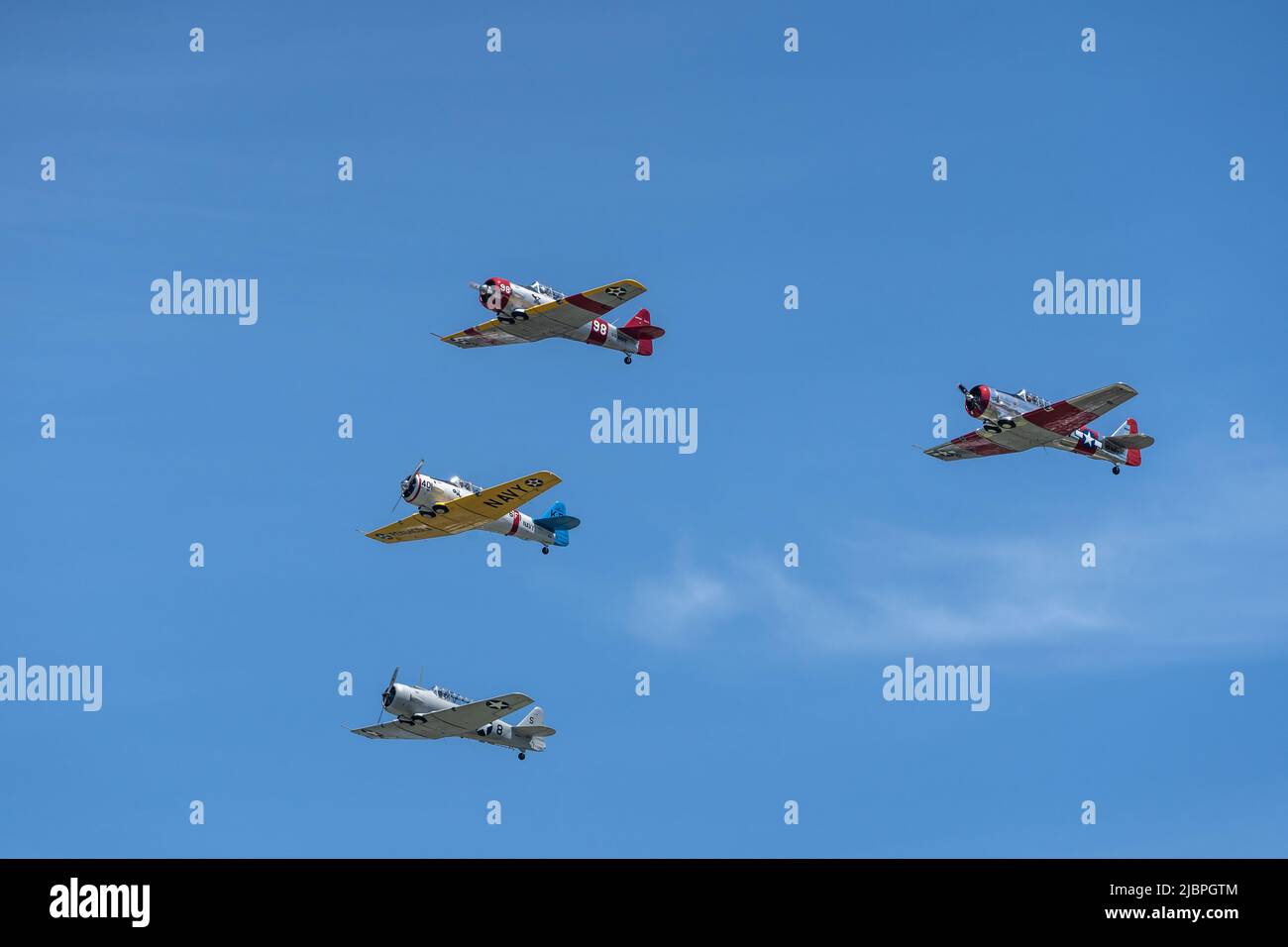 Reading, Pennsylvania, USA-June 6, 2021: Four WWII airplanes do a flyby against a blue sky background during the Mid-Atlantic Museum WWII weekend Stock Photo