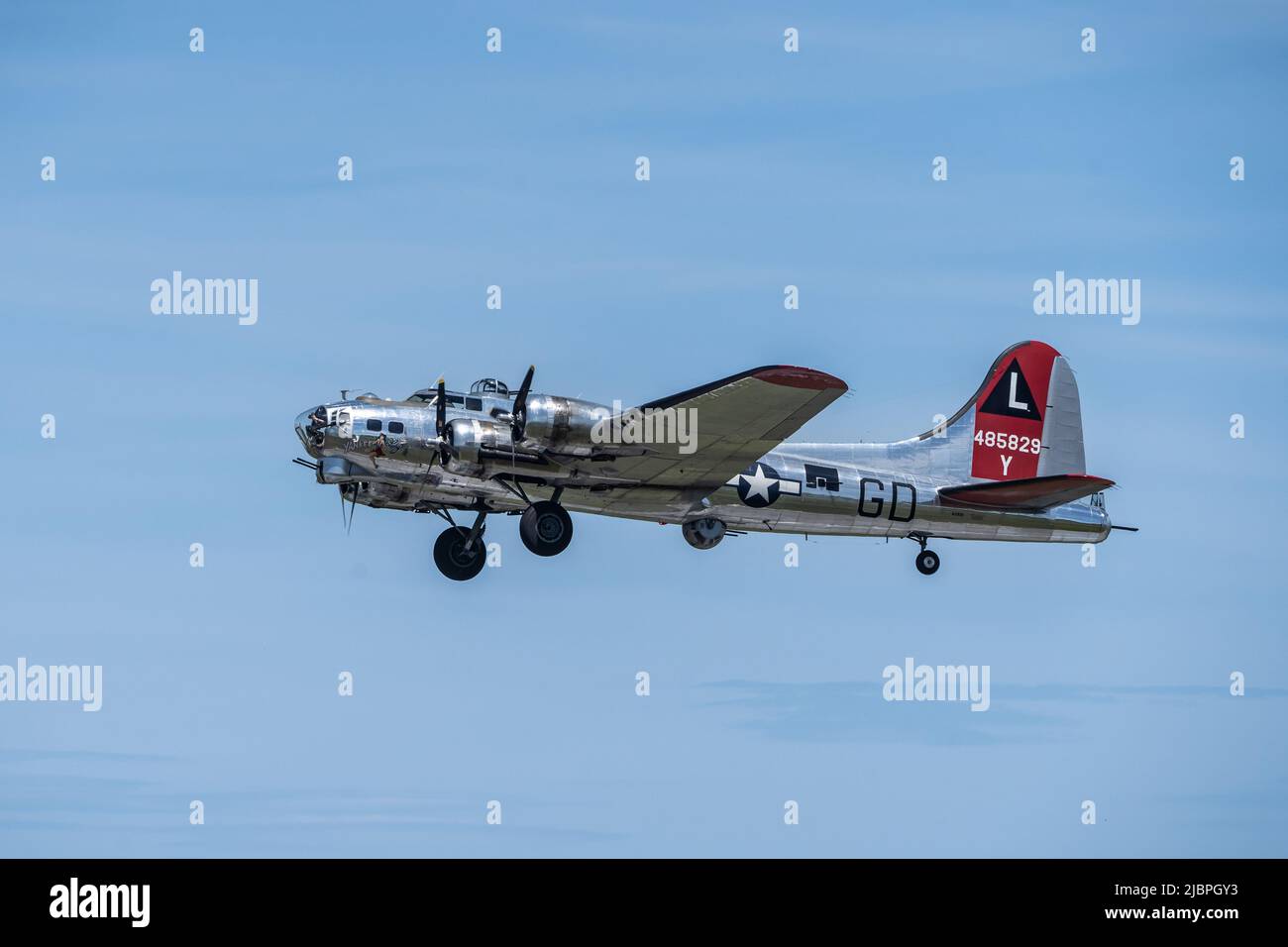 WWII Boeing Flying Fortress against a blue sky background Stock Photo