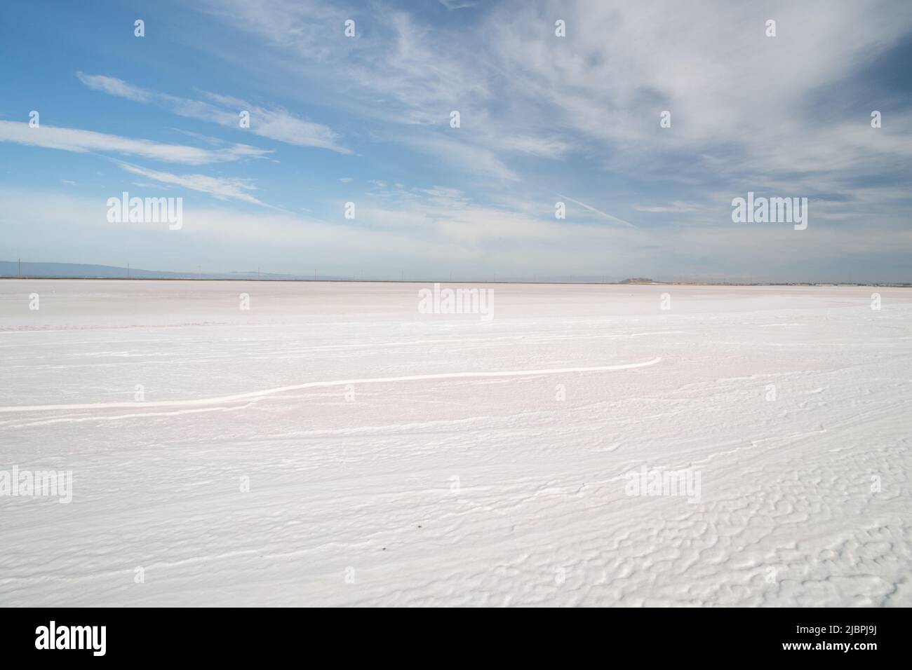 The vast open landscape of the salt fields where seasalt is produced. Stock Photo