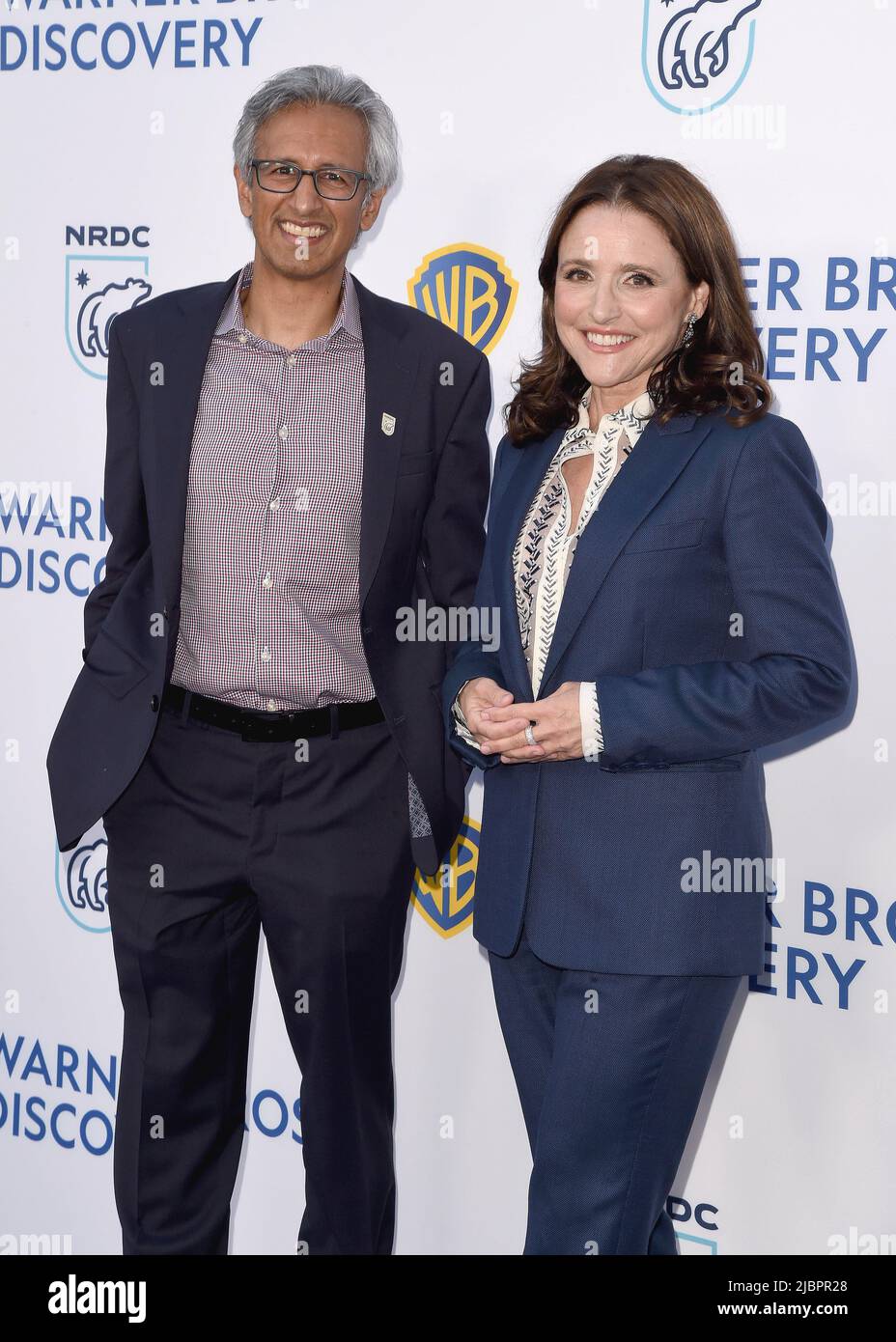 Manish Bapna and Julia Louis-Dreyfus walking on the red carpet at the