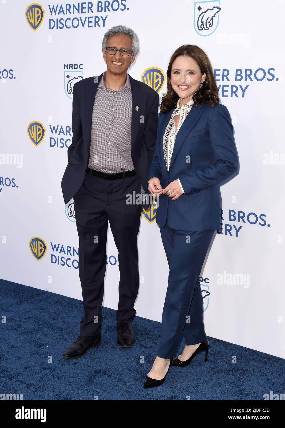 Manish Bapna and Julia Louis-Dreyfus walking on the red carpet at the