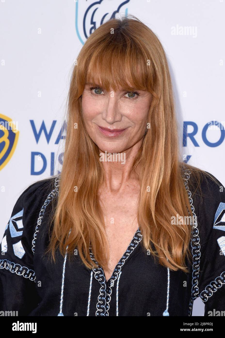 Kelly Lynch walking on the red carpet at the NRDC night of Comedy at