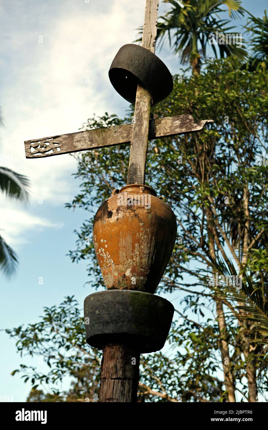 A totem pole in Nanga Raun village, Kalis, Kapuas Hulu, West Kalimantan, Indonesia. 'The pole is a sign of the settlement area in the village, as well as a symbol to greet ancestor spirits,' said an elder in the village that is mostly inhabited by the indigenous Orung Da'an Dayak community. Stock Photo