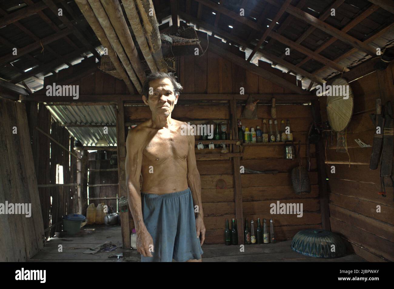 Portrait of Daniel Rajang, former tumenggung (traditional chief) of Orung Da'an Dayak community, at his farming hut in Nanga Raun village, Kalis, Kapuas Hulu, West Kalimantan, Indonesia. The Orung Da'an community once had the longest longhouse in Kalimantan, but it was vanished after a fire accident a few decades back, he said. Stock Photo