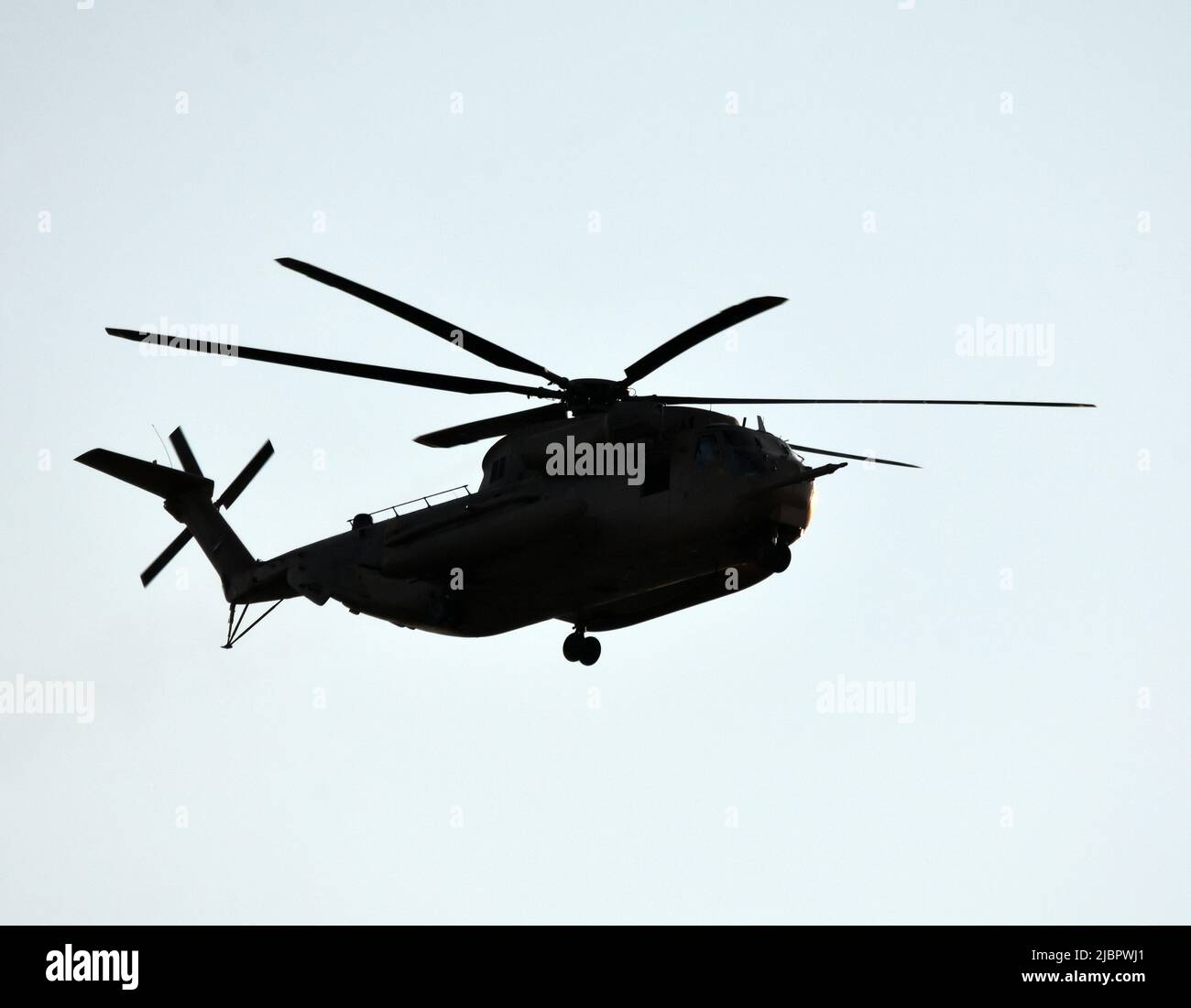 Sikorsky CH53 helicopter silhouette.in flight Stock Photo