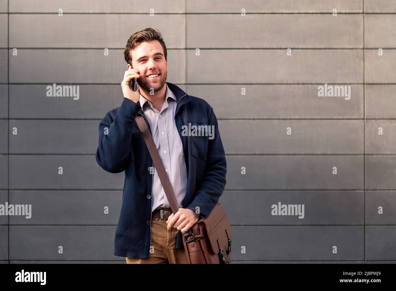 smiling caucasian businessman talking on the phone Stock Photo