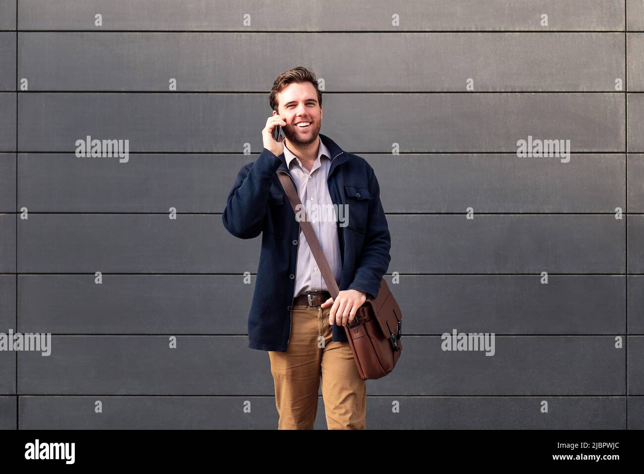 happy entrepreneur caucasian man talking by phone Stock Photo