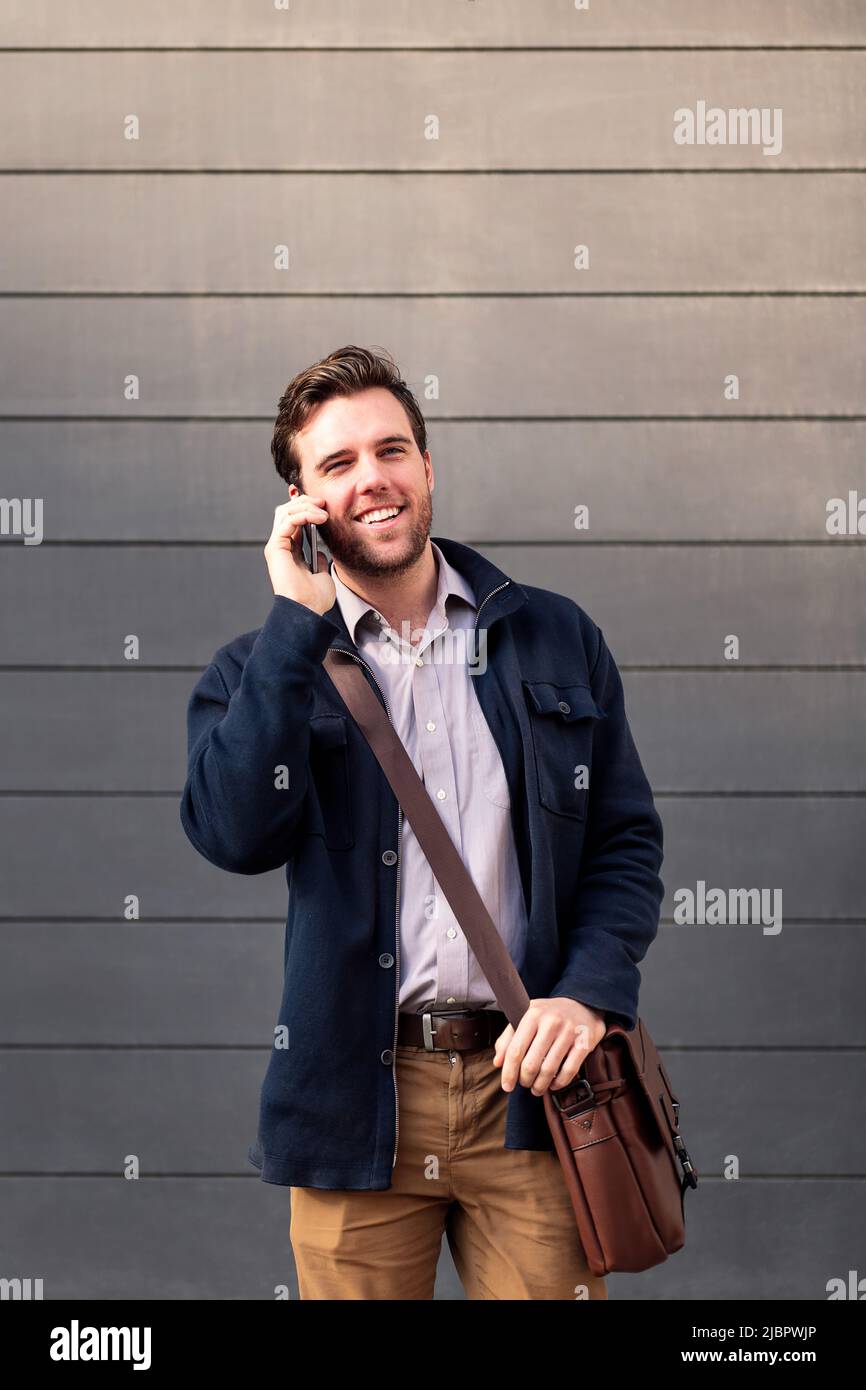 smiling caucasian businessman talking on the phone Stock Photo