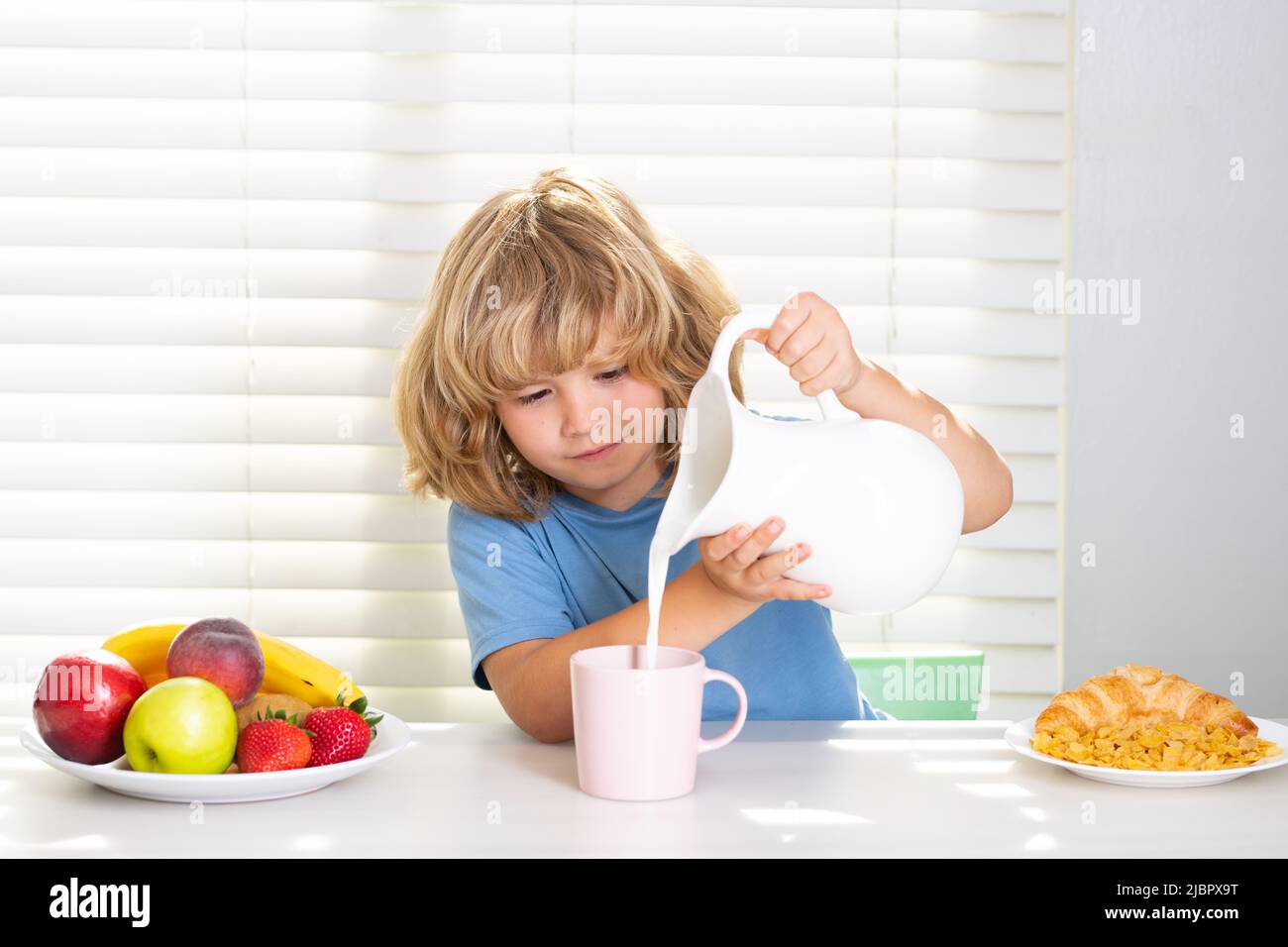 kid-pouring-whole-cows-milk-schoolchild-eating-breakfast-before-school