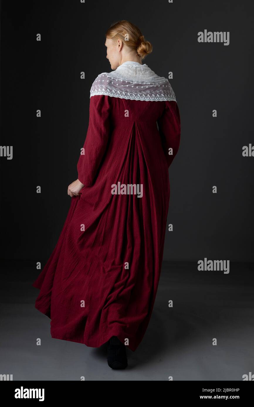 A working class Regency woman wearing a red dress Stock Photo