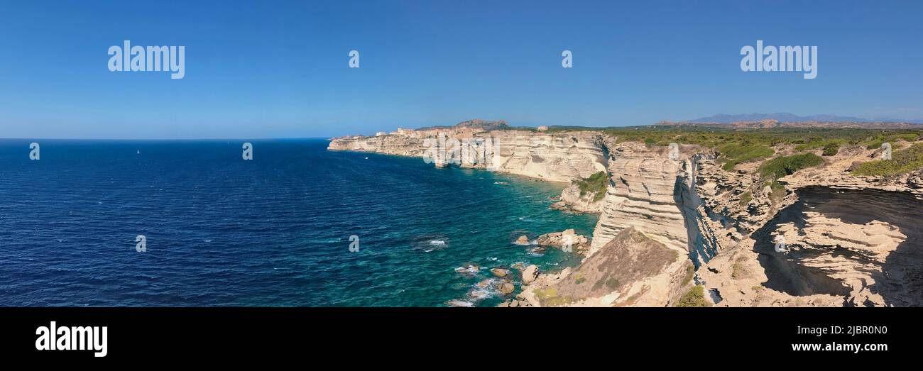 Bonifacio- Corsica coastline with limestone cliff overlooking the sea on clear blue sky Stock Photo