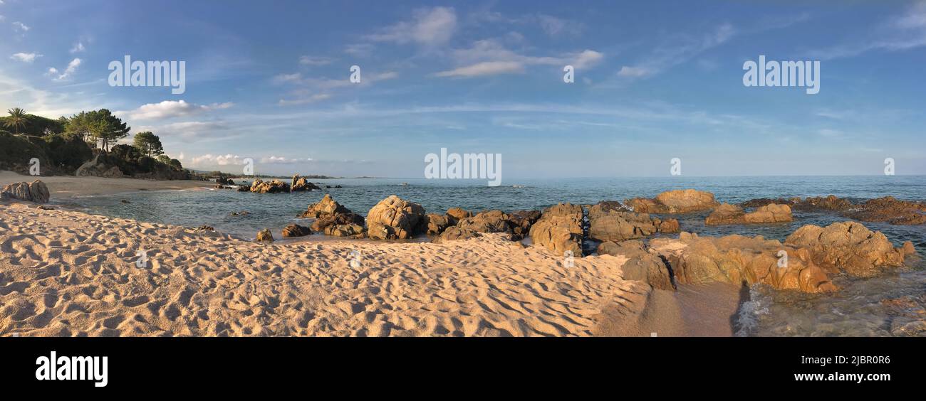 panoramic view on a Corsica  beach  with rock in the sea - summer vacation Stock Photo