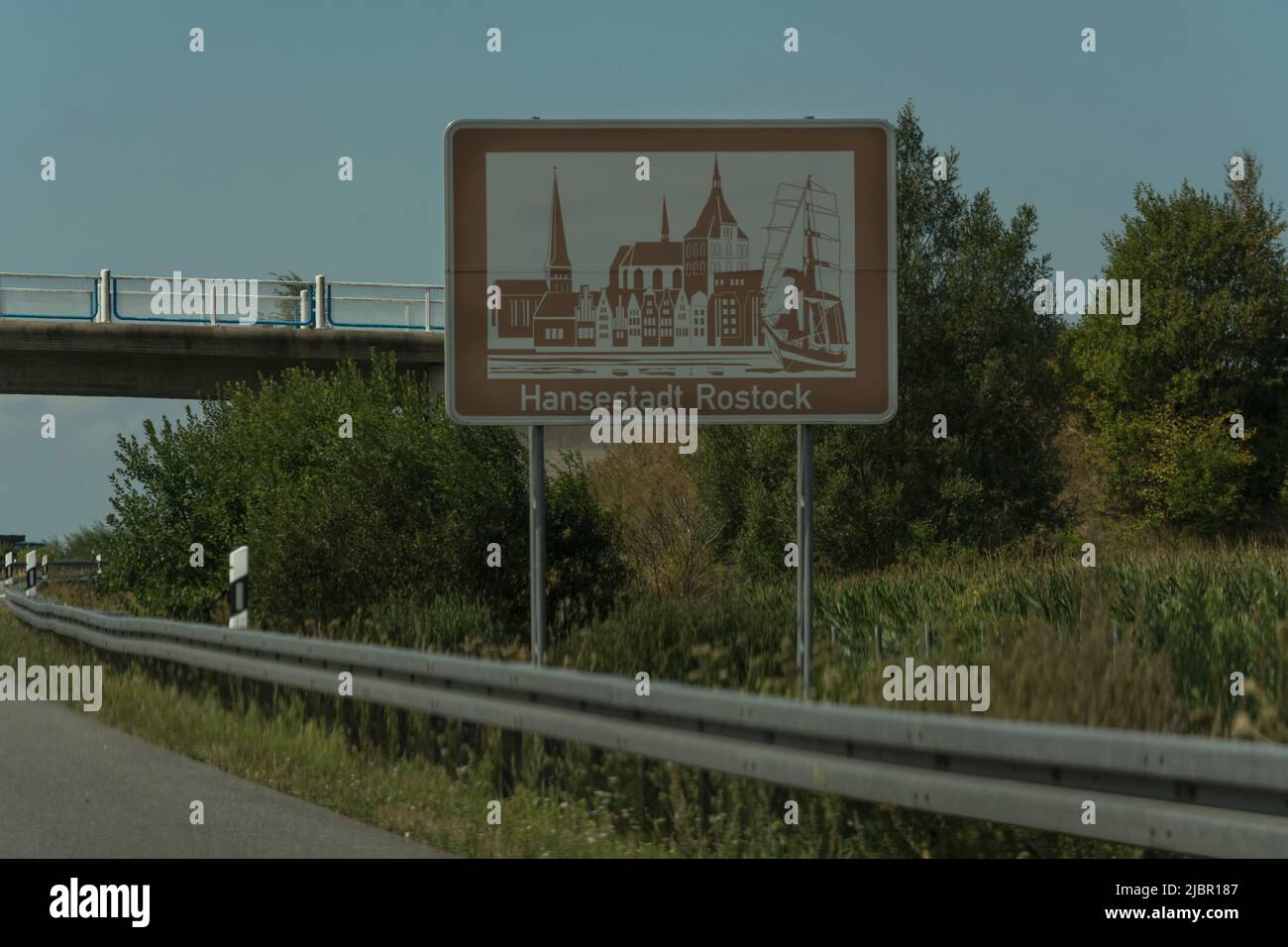 Autobahn sign in Germany Caption on German - city names Rostock Stock