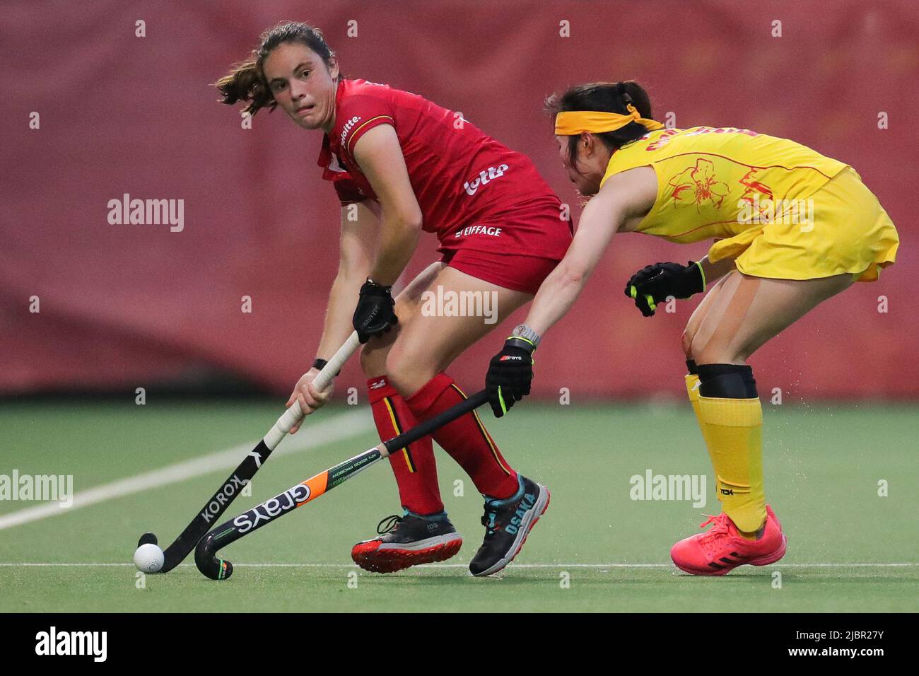 Antwerp, Belgium. 7th June, 2022. Tiphaine Duquesne (L) of Belgium vies with Chen Ling of China during their FIH Hockey Pro League match in Antwerp, Belgium, June 7, 2022. Belgium women's hockey team beat Chinese women's hockey team by 3-1. Credit: Zheng Huansong/Xinhua/Alamy Live News Stock Photo