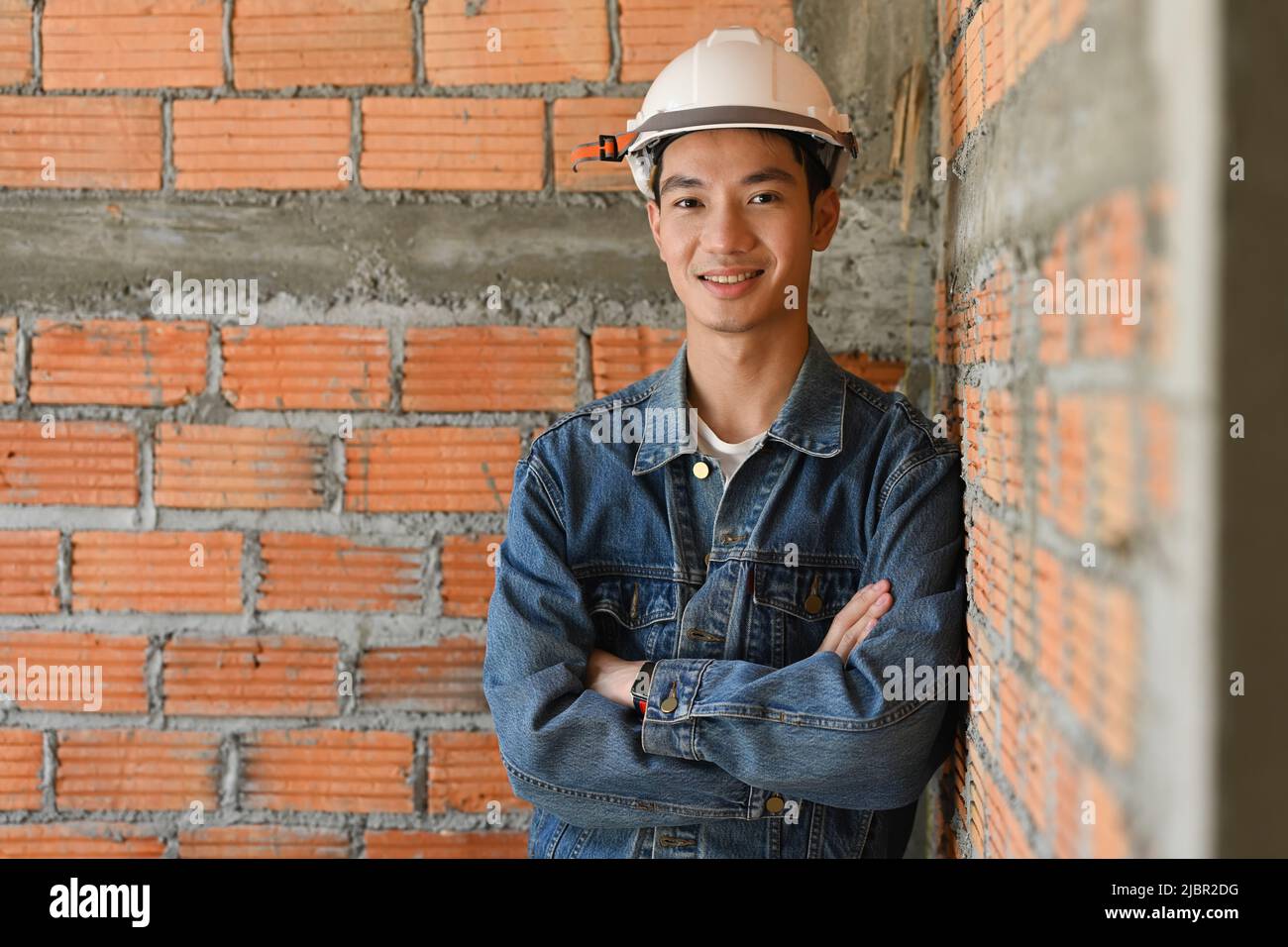 Architects male wearing safety helmet standing construction site ...