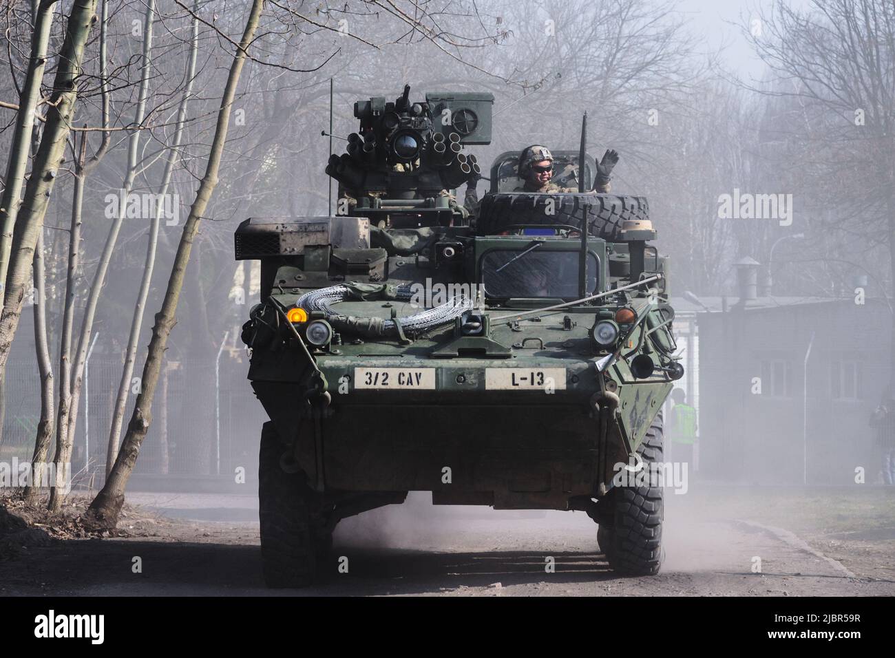 Lublin, Poland - March 25, 2015: United States Army vehicle (Armored Personnel Carrier) Stryker passing city streets Stock Photo