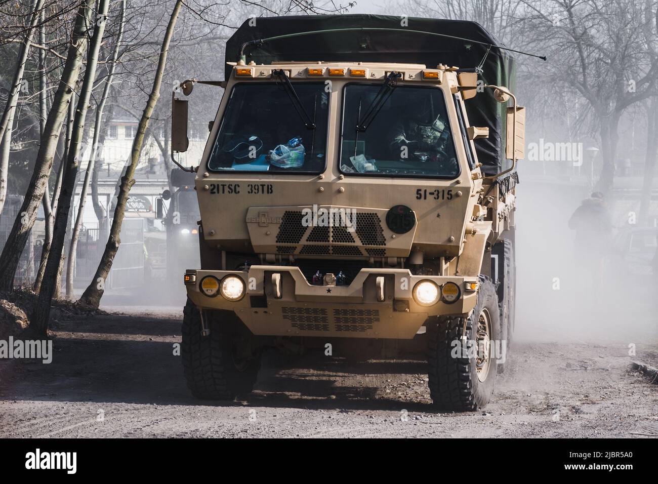 Lublin, Poland - March 25, 2015: United States Army Oshkosh Medium Tactical Vehicle passing city streets Stock Photo