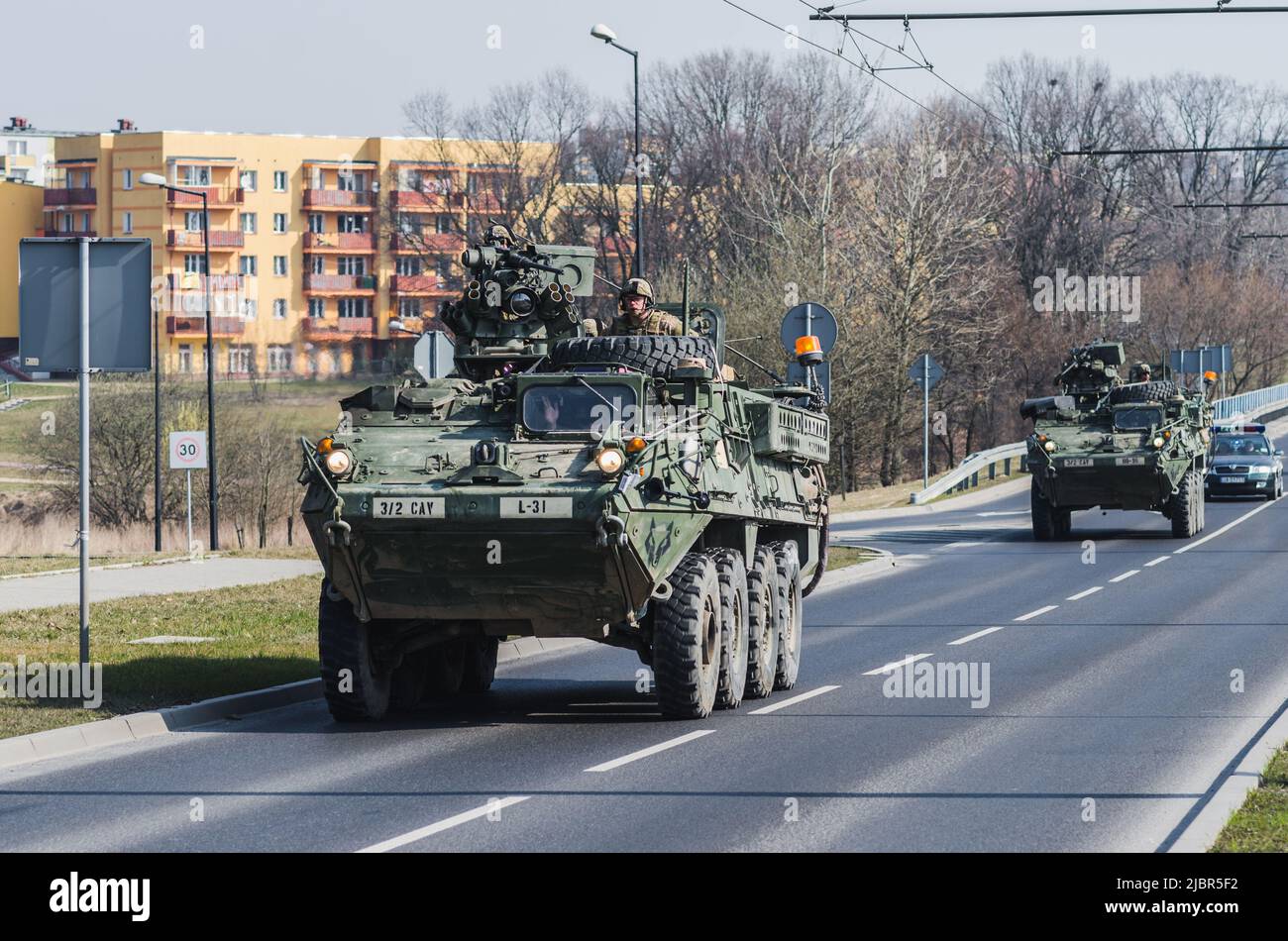 Lublin, Poland - March 25, 2015: United States Army vehicle (Armored Personnel Carrier) Stryker passing city streets Stock Photo