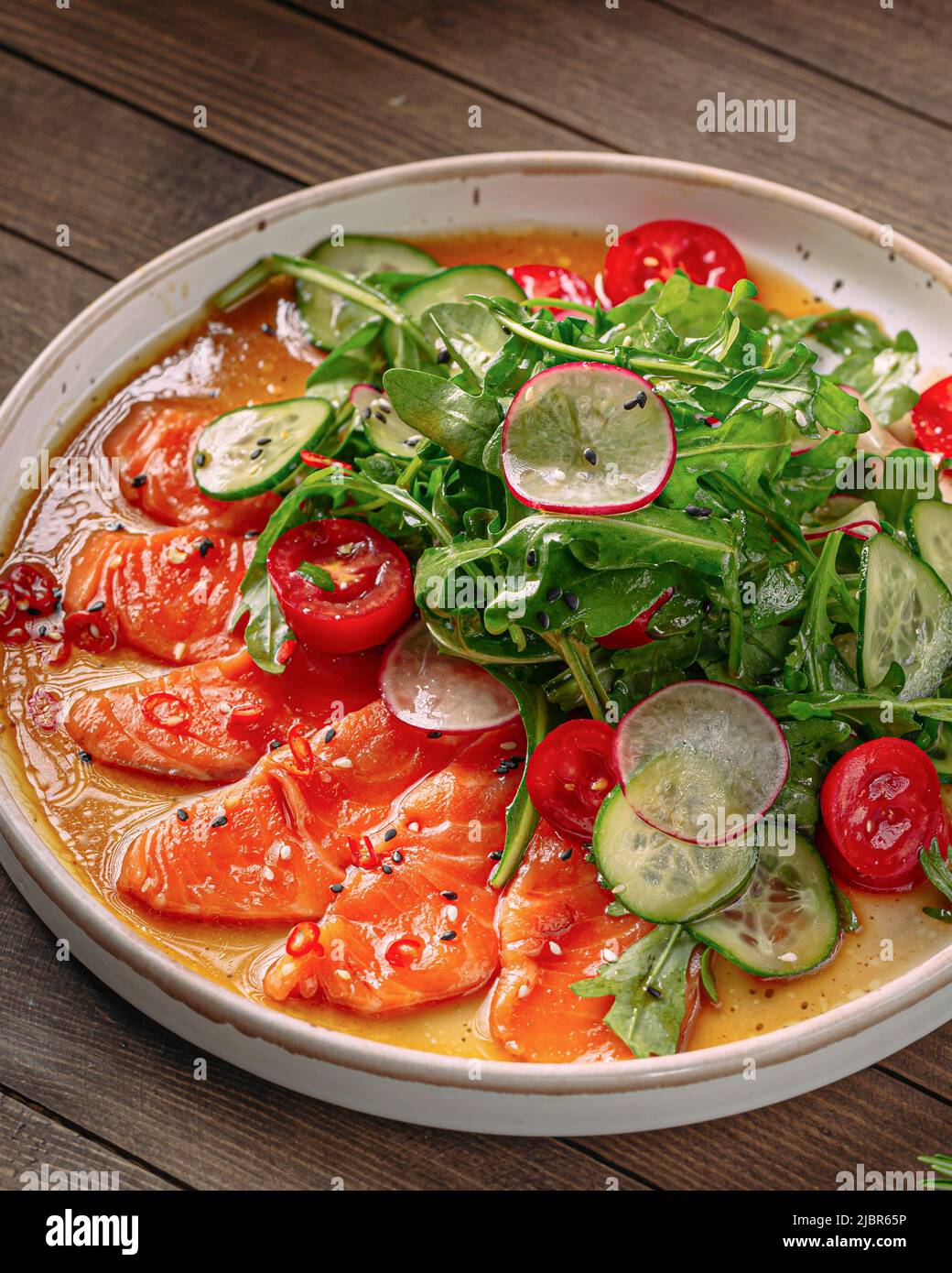 Plate of gourmet salmon carpaccio salad Stock Photo Alamy