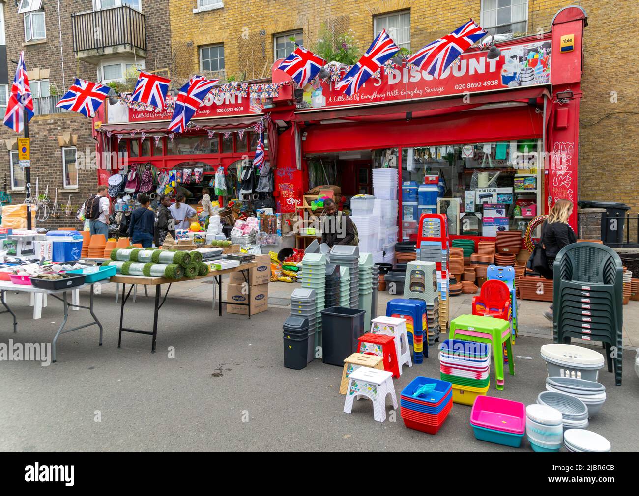 Discount bargain goods on sale on shop pavement, Deptford High Street