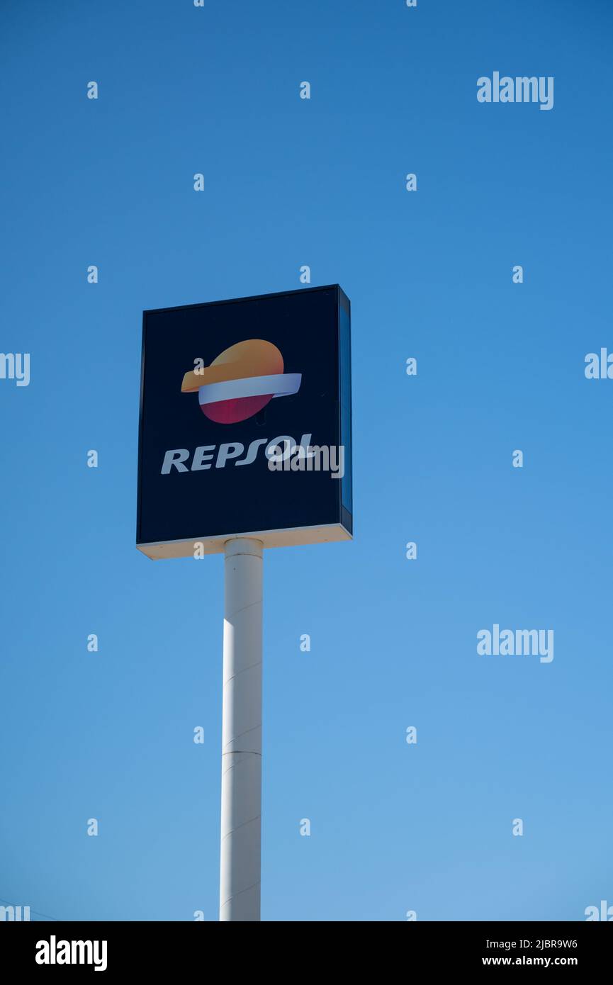 A Repsol fuel advertising sign in Spain against a sunny blue sky Stock Photo