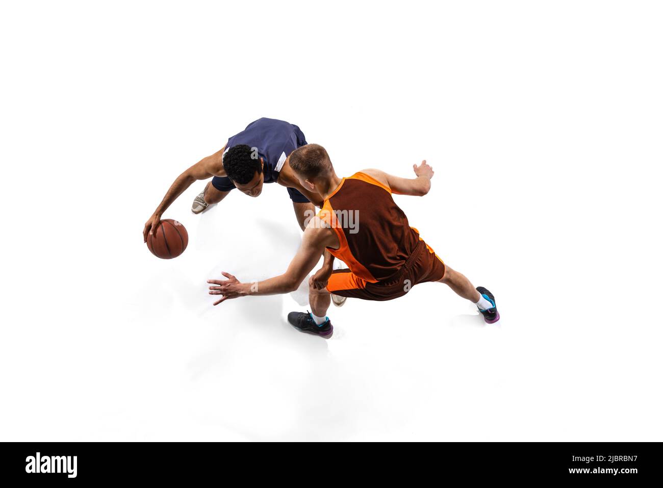 Top view portrait of two men, professional basketball players in motion