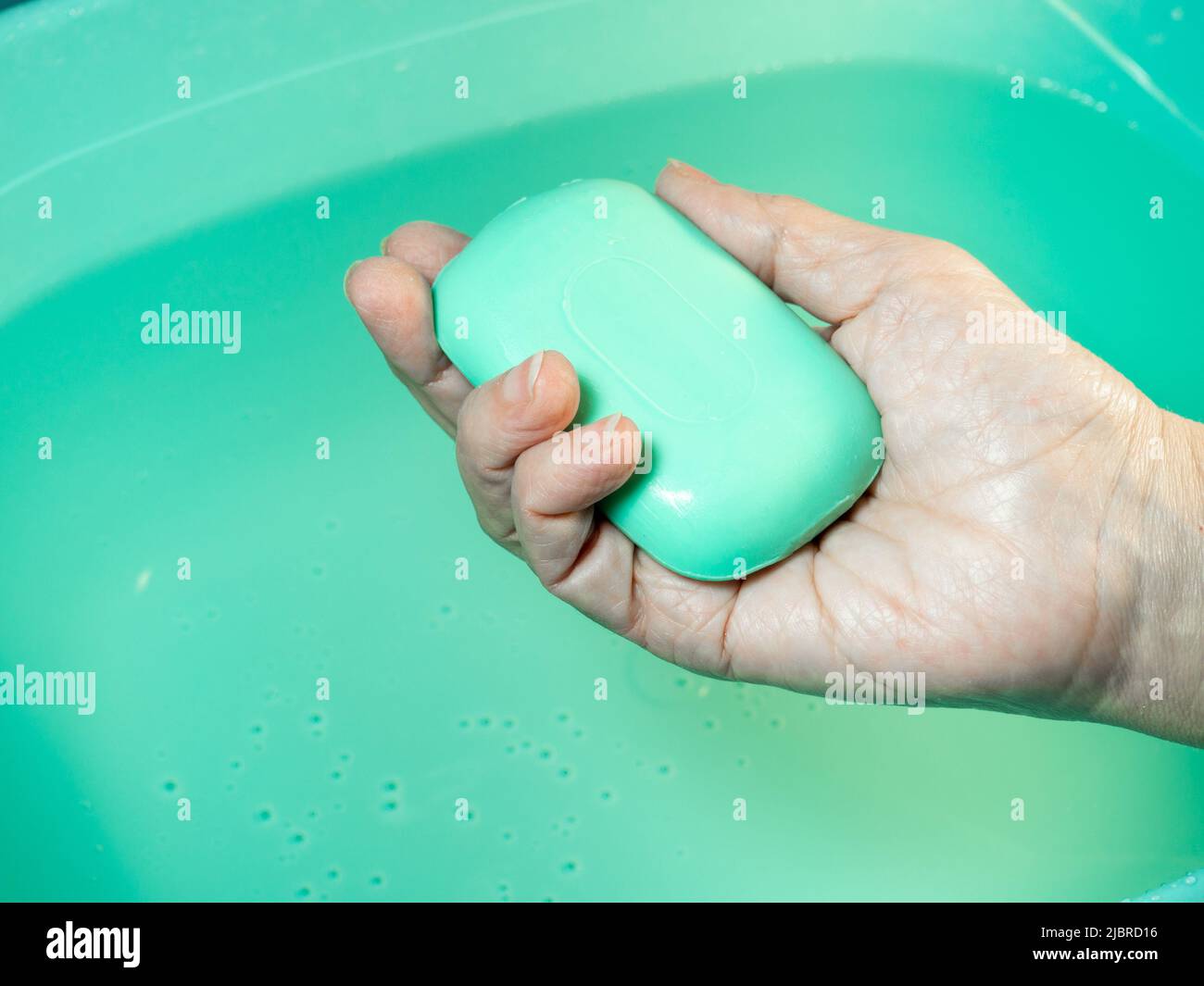 Hand washing. Toilet soap in hand. Green soap. Hand washing. Hygiene