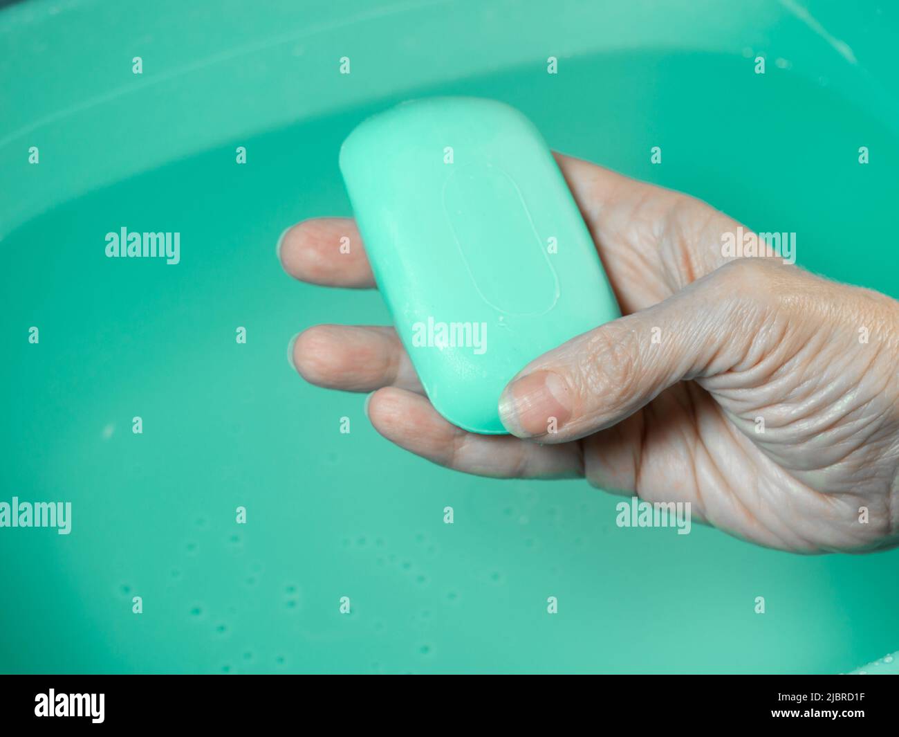 Hand washing. Toilet soap in hand. Green soap. Hand washing. Hygiene