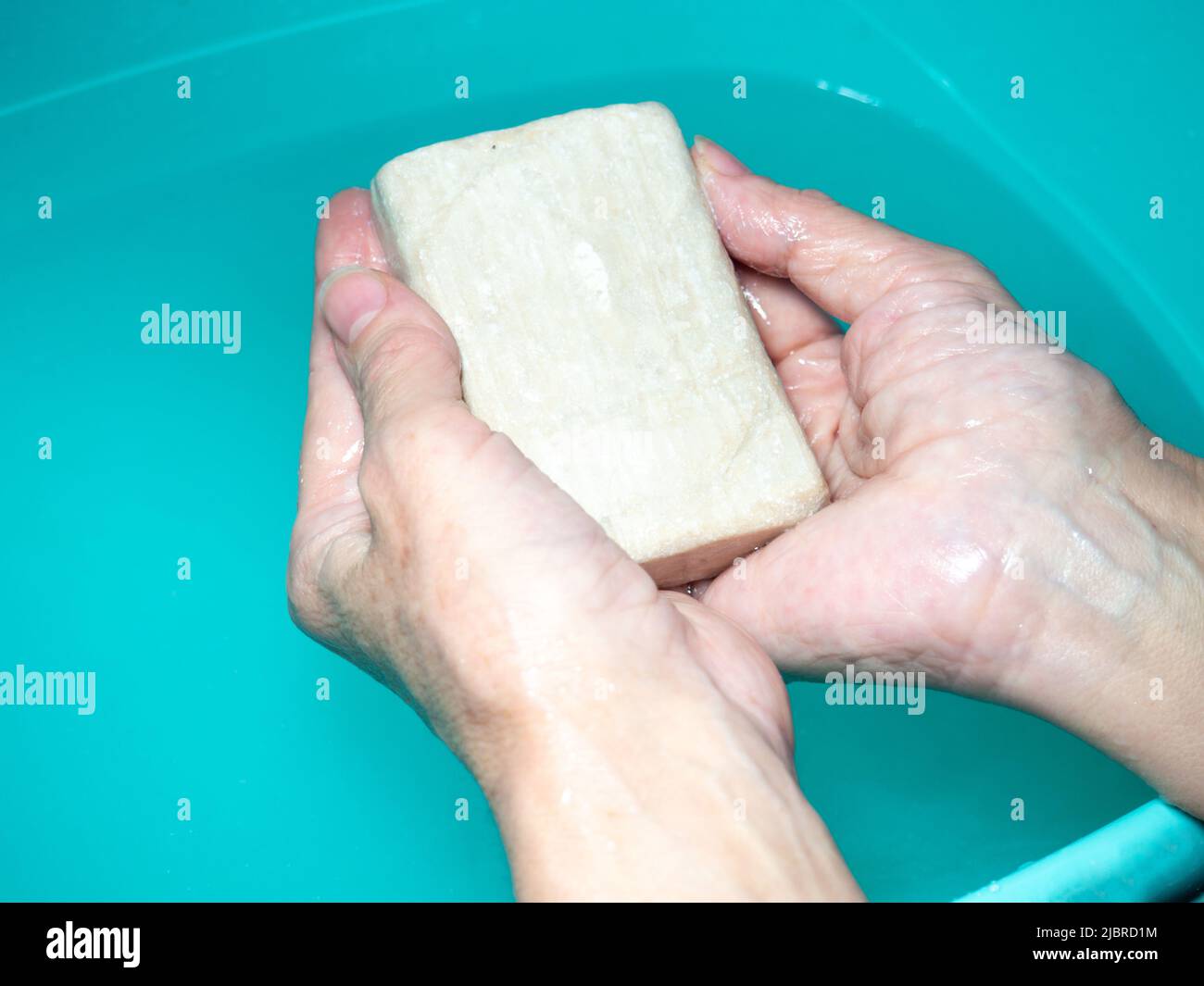 Hand washing. Laundry soap in hand. Green soap. Handwash. Hygiene Stock ...