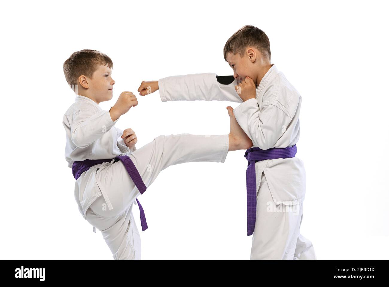 Karate boys training kick Cut Out Stock Images & Pictures - Alamy