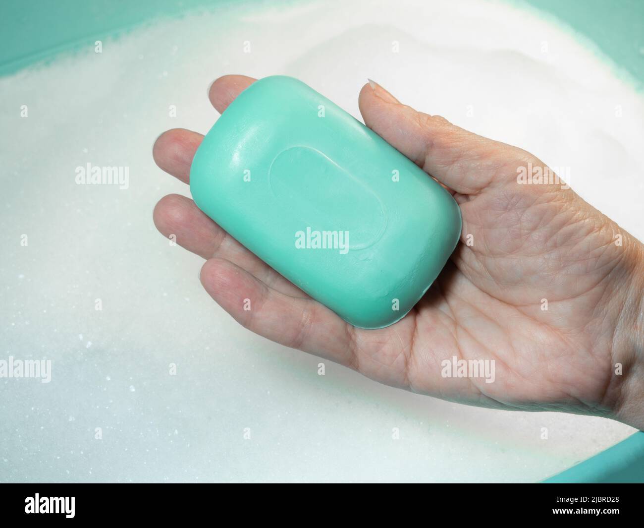 Hand washing. Soap in hand. Green soap. Handwash. Hygiene Stock Photo