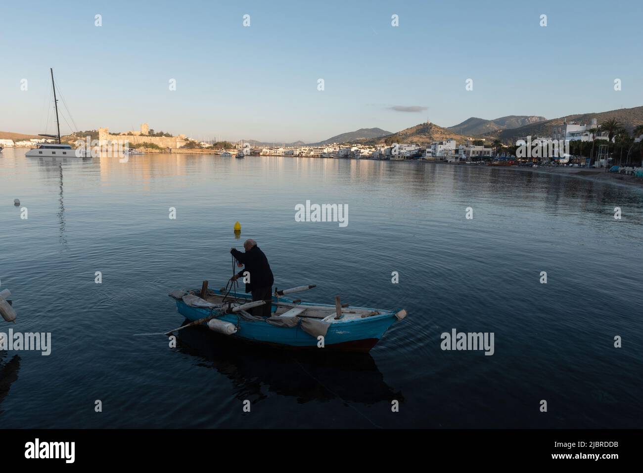 Bodrum, Mugla, Turkey. April 21st 2022 A fisherman at dawn in the beautiful harbour of Bodrum on the Turkish southwest coast of the Aegean Sea, Turkey Stock Photo