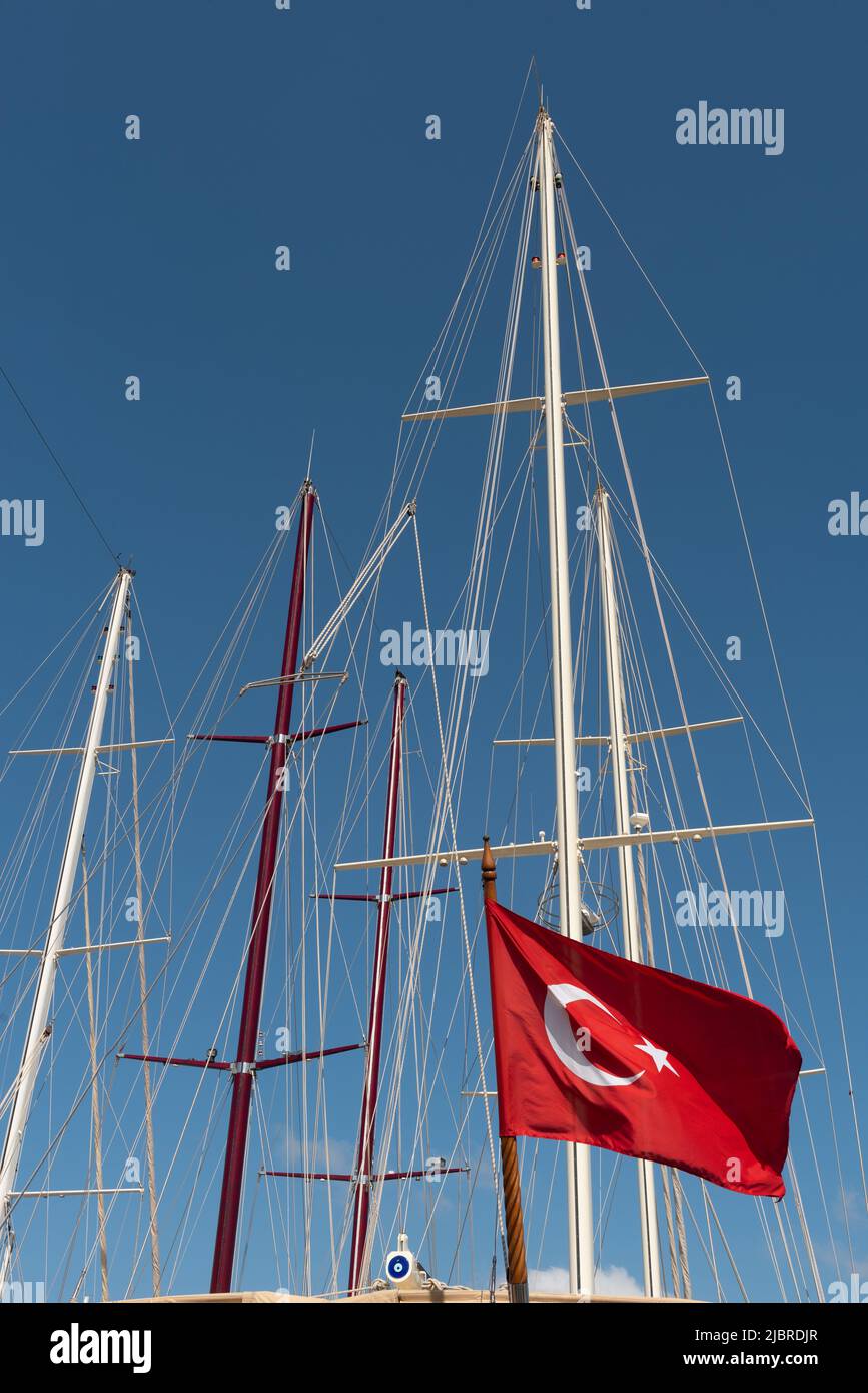 Dramatic abstract view of the masts of sailing boats in a Turkish harbour on the Aegean Sea in Southwest Turkey. Stock Photo